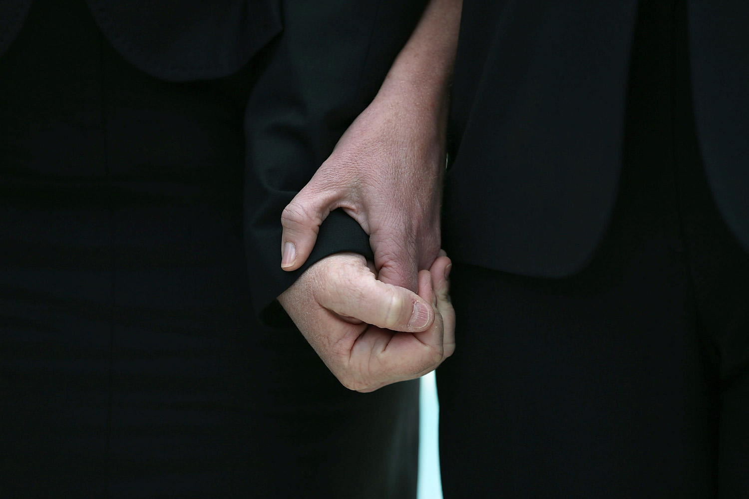 March 26, 2013. Plaintiff couple Sandy Steier (L) and Kris Perry hold hands after attending oral arguments at the U.S. Supreme Court after oral arguments in Washington, DC. This week, the high court heard arguments in California's Proposition 8, the controversial ballot initiative that defines marriage as between a man and a woman.