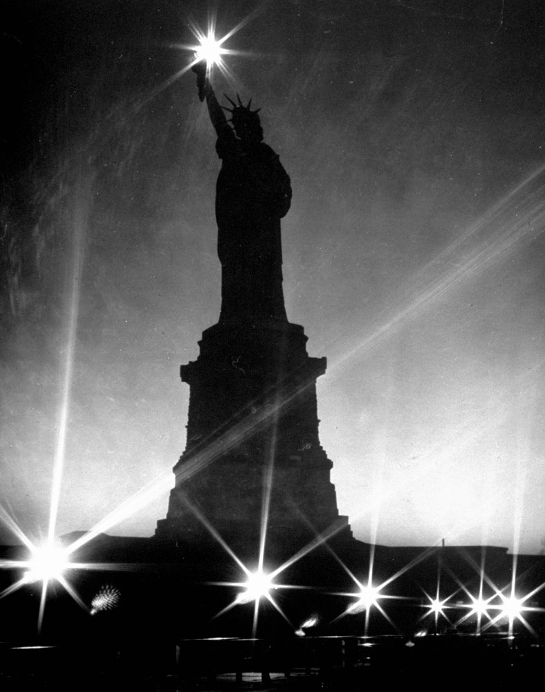 The Statue of Liberty seen during a WWII blackout, 1942.