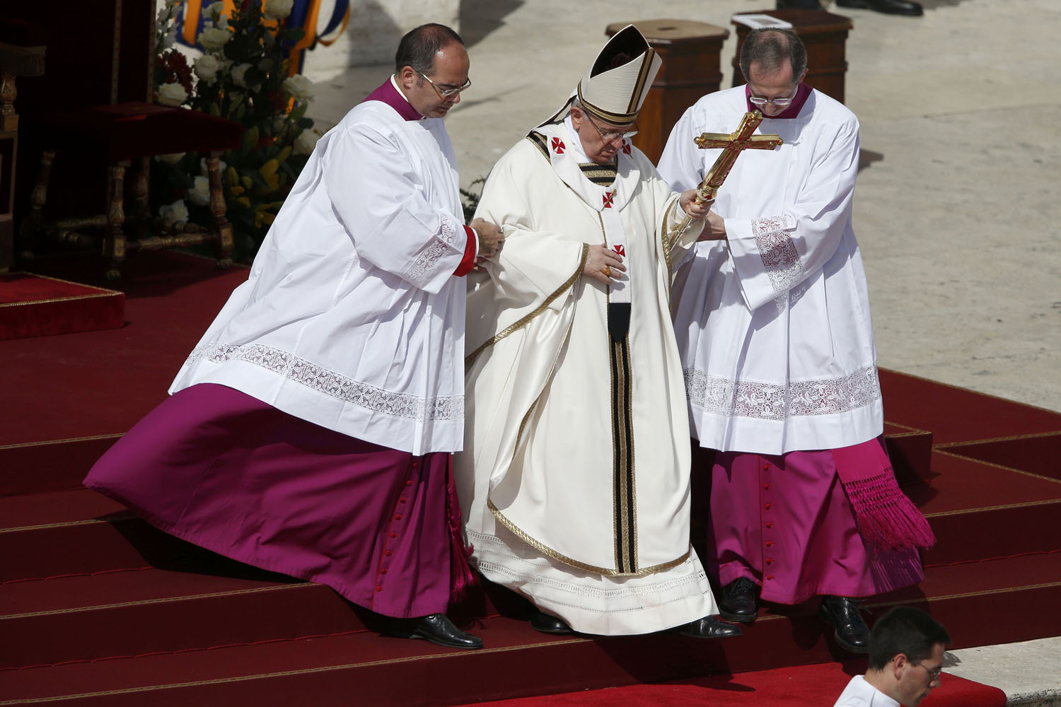 Pope Francis descends the stairs as he takes part in his inaugural mass in Saint Peter's Square at the Vatican