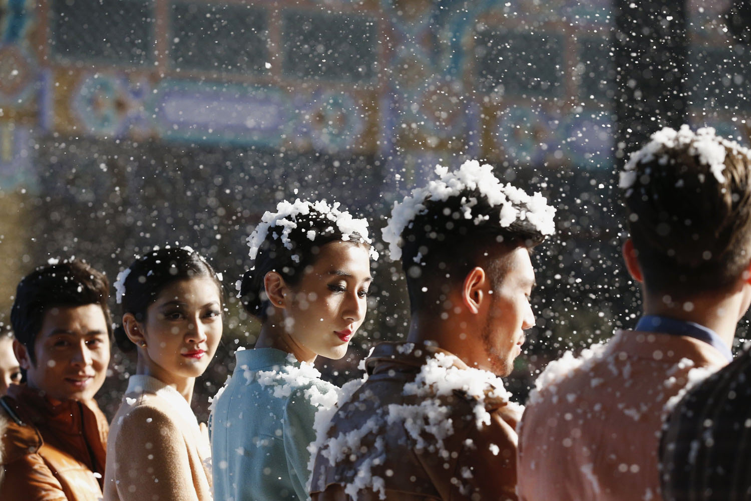 March 26, 2013. Model are seen covered with artificial snow flakes during a fashion show of VISCAP Yuan Bing collection at China Fashion Week in Beijing. The fashion week runs till March 30.