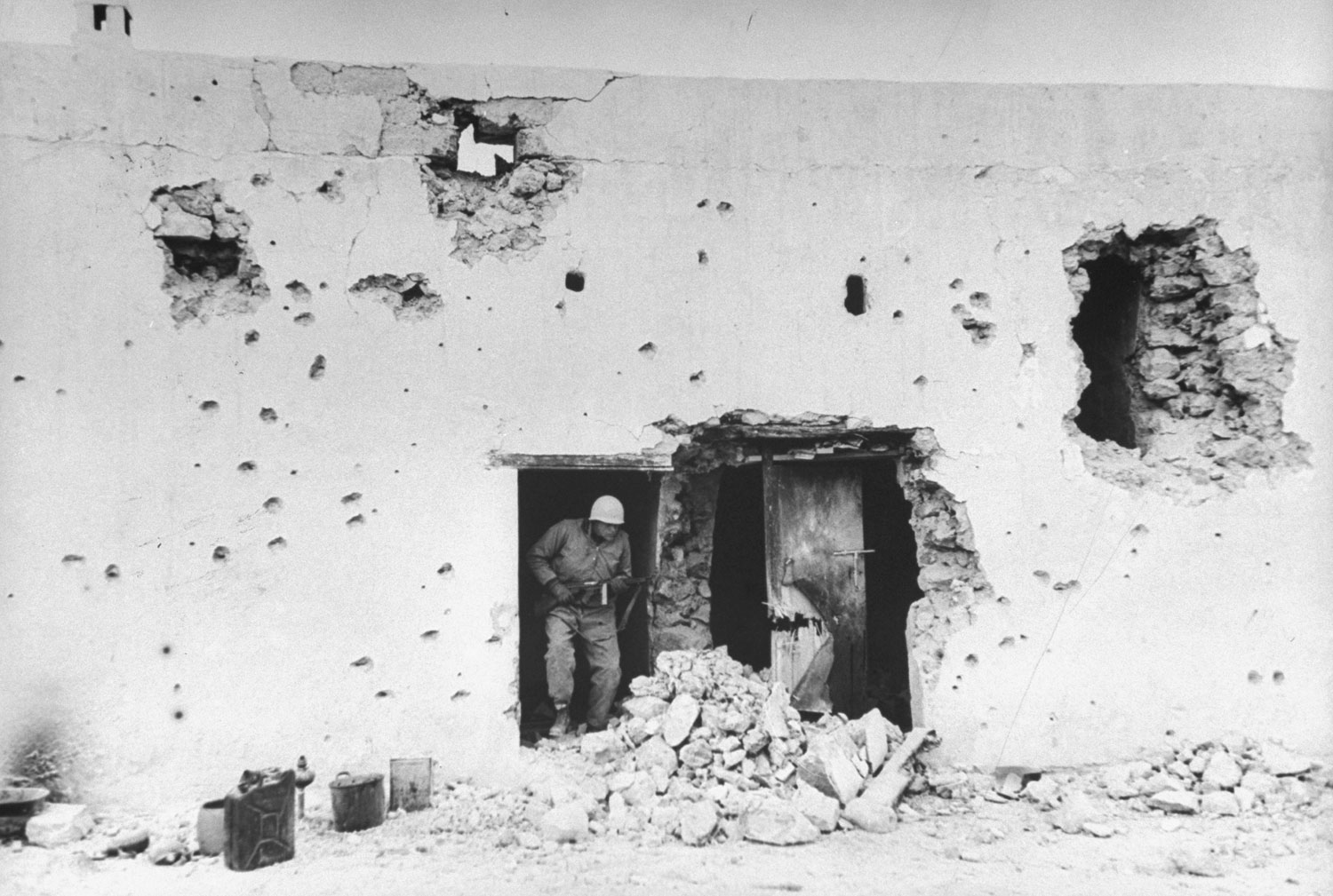 Shelled building behind Italian gun position, Tunisia, 1943.