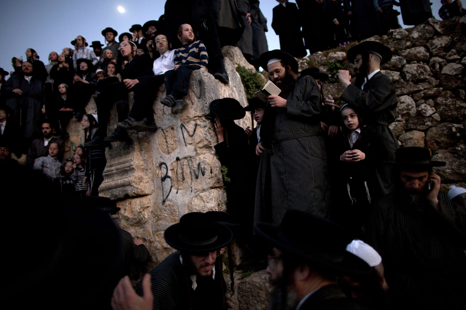 March 24, 2013. Ultra-Orthodox Jews collect water to make matza during the Maim Shelanoo ceremony at a mountain spring, in Jerusalem Sunday. The water is used to prepare the traditional unleavened bread for the high holiday of Passover.