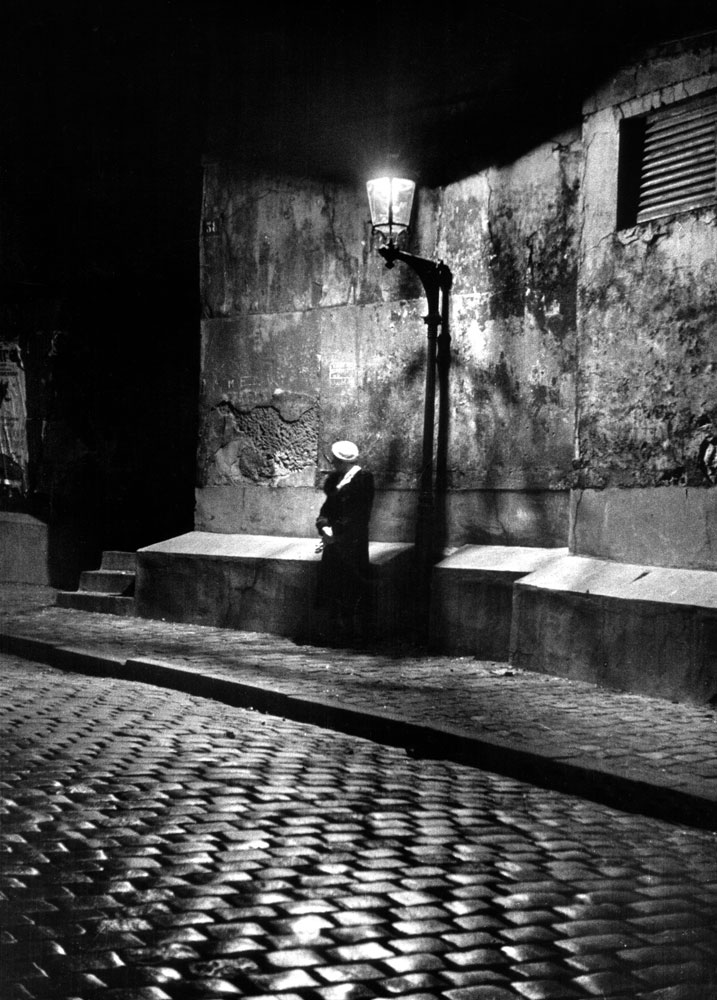 Woman under streetlight in Montmartre at night, 1963.