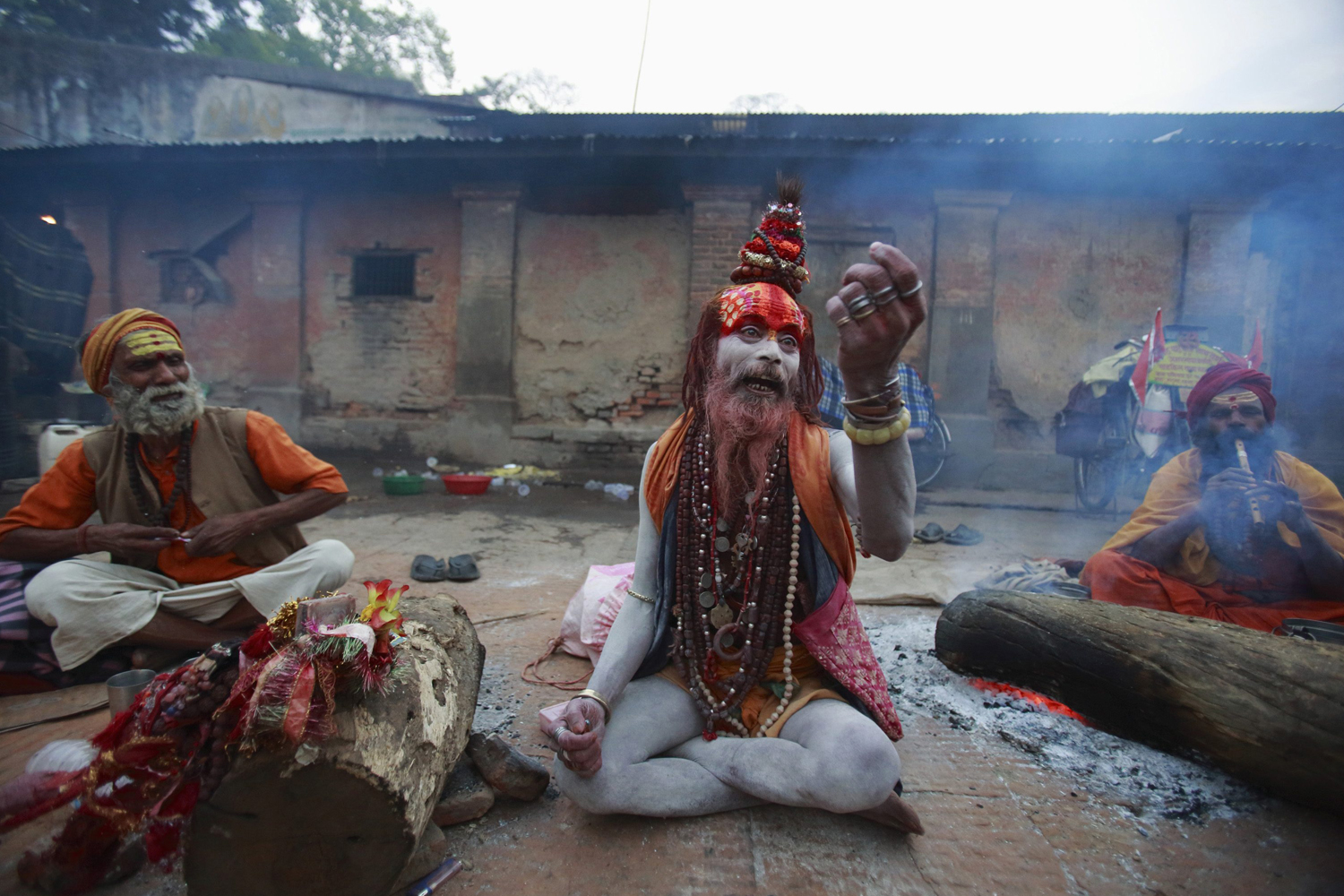 A sadhu asks for money from devotees on the premises of Pashupatinath Temple during the Shivaratri festival in Kathmandu