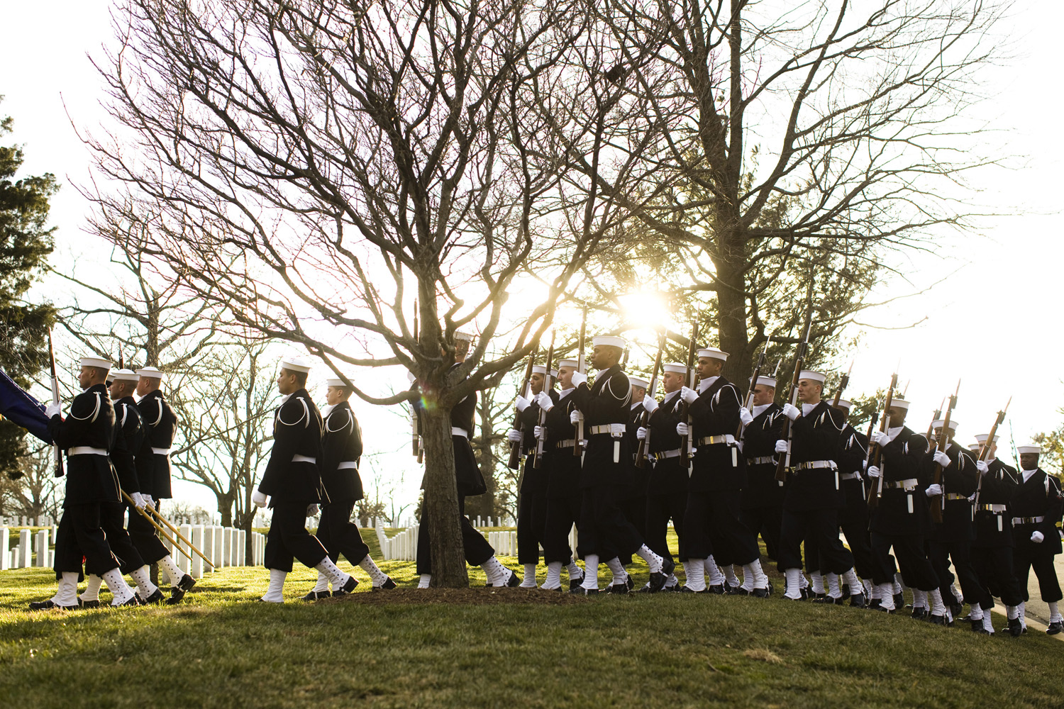 A procession of sailors at Arlington National Cemetery to bury a pair of Civil War Navy predecessors.
