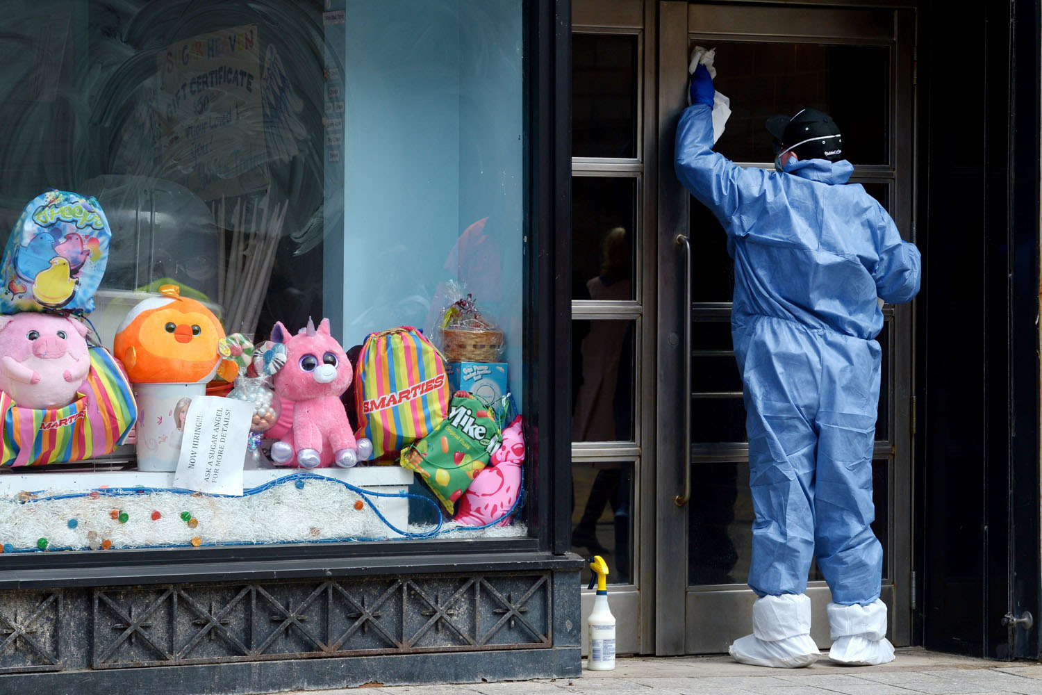 April 24, 2013. A man works on making repairs to businesses near the site of the second bombing at the finish line of the Boston Marathon on Boylston Street in Boston.