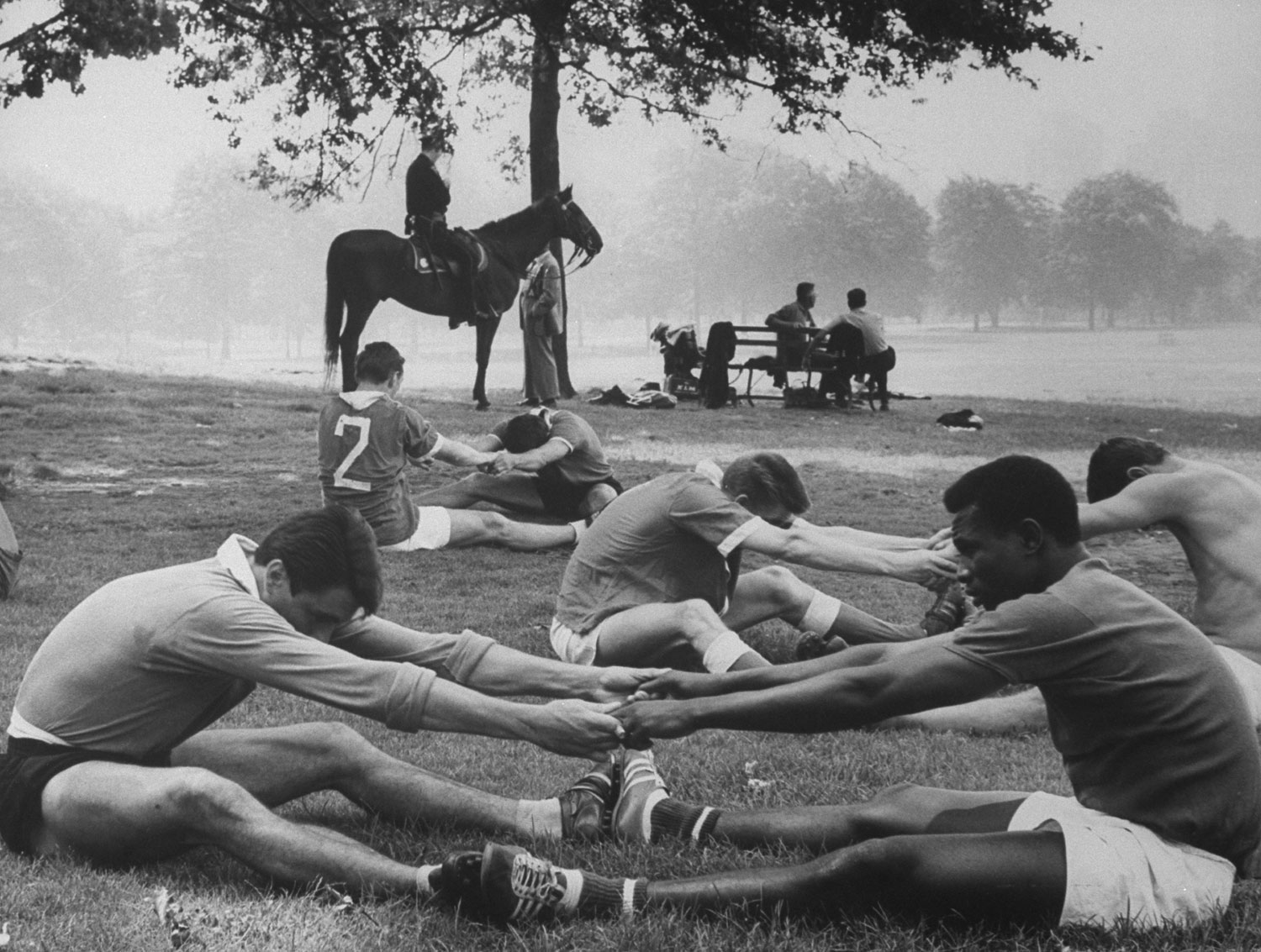 Warming up before a soccer match, Central Park, 1961.