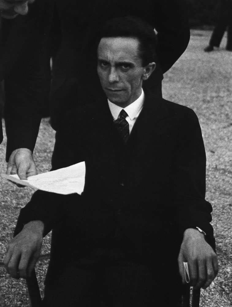 Hitler's Minister of Propaganda Joseph Goebbels glowers at photographer Alfred Eisenstaedt in the garden of the Carlton Hotel during a League of Nations conference, Geneva, September 1933.