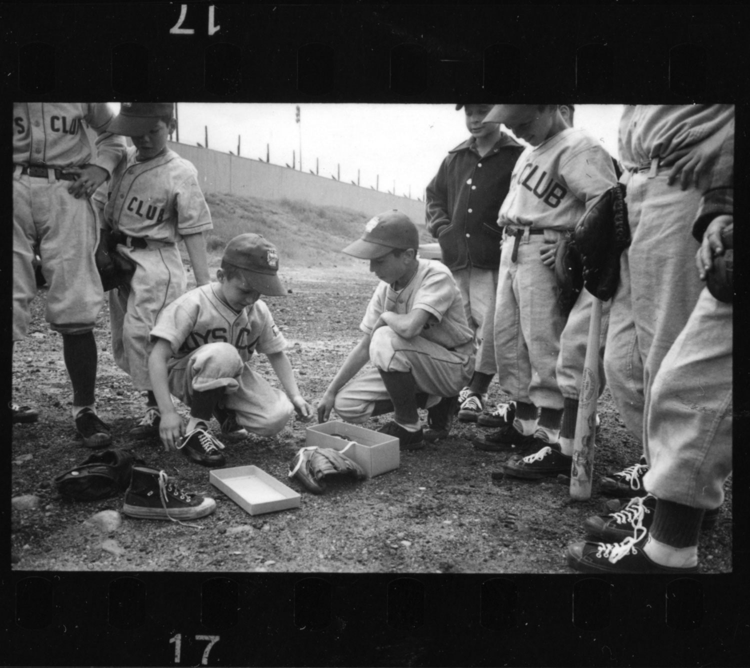 Players trying on cleats during the 1954 Manchester, New Hampshire, Little League season.