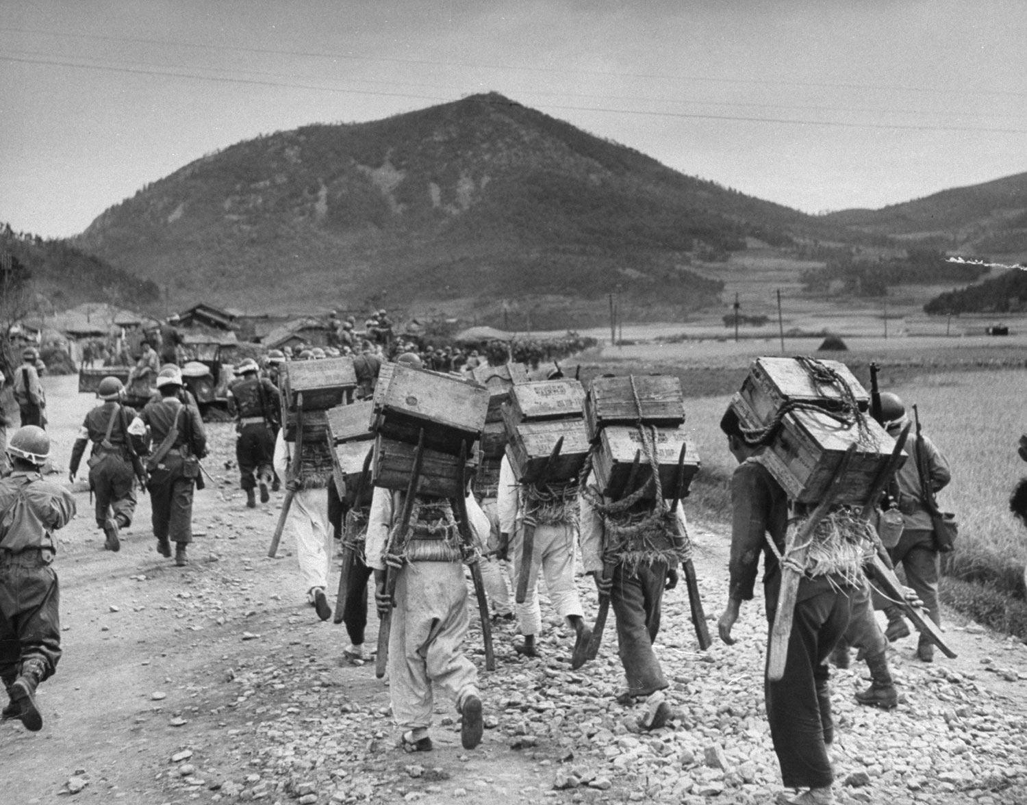 South Korean soldiers advance toward the front line during a communist uprising in 1948.