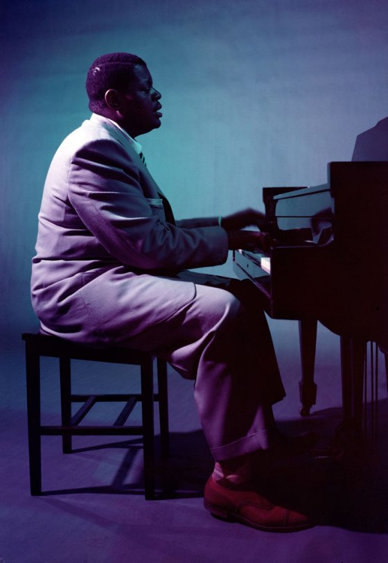 By keeping the beat sharp and the complex embellishments clean, Oscar Peterson, a constantly nodding 265-pound pianist with a light touch, established a style that departs from 'barrel house,' moving toward modern jazz.
