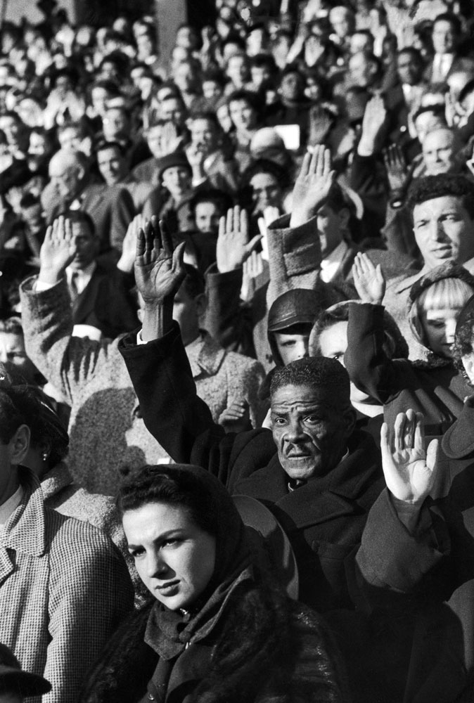 New American citizens take oath during a mass naturalization ceremony, New York, 1954.