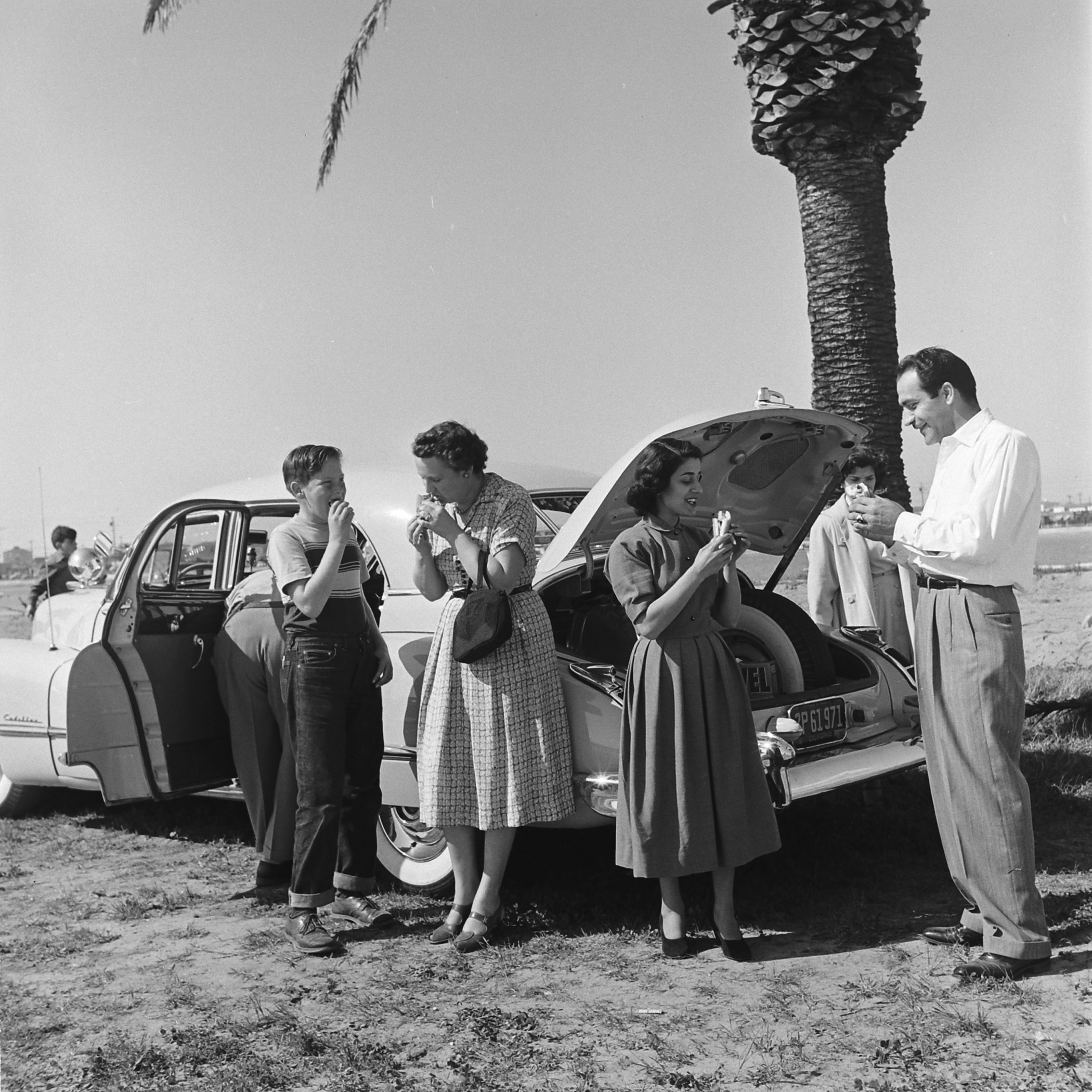 A picnic on the beach, courtesy of Louis Mattar's tricked-out 1947 Cadillac.