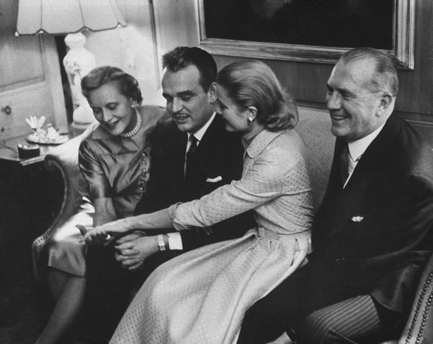 Grace Kelly and Prince Rainier show her engagement ring to her mother and father at the Kelly home in Philadelphia, 1956.