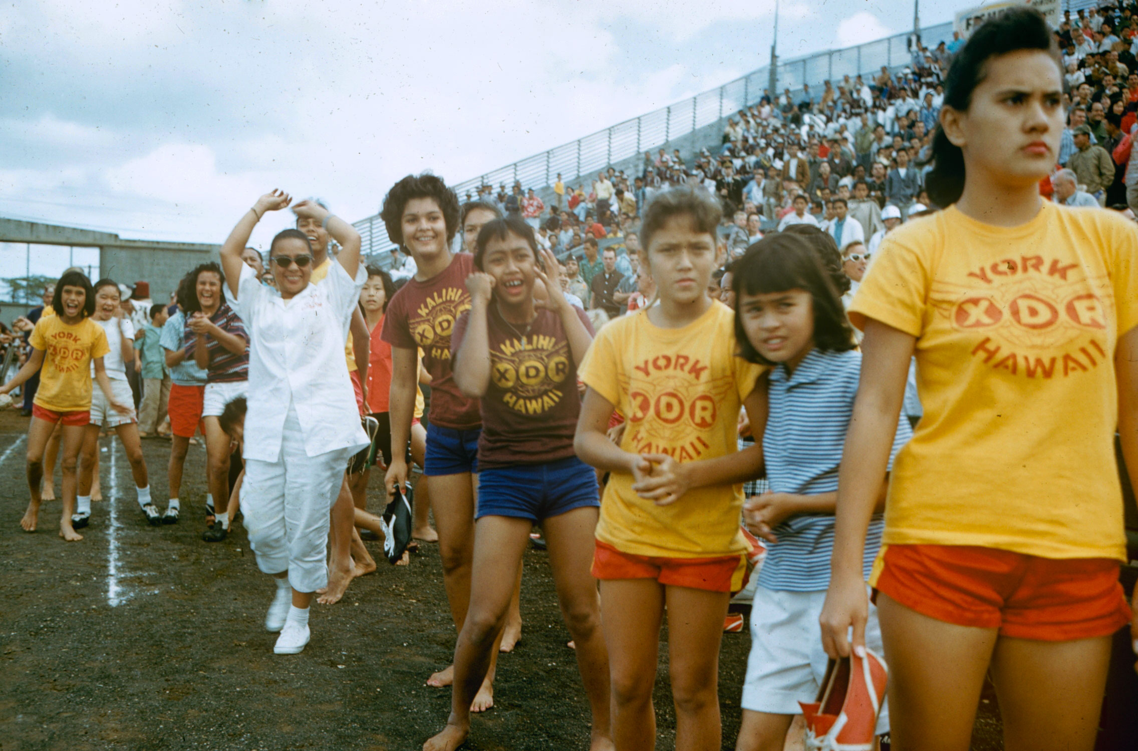 Fans at a football game, Hawaii, 1959.
