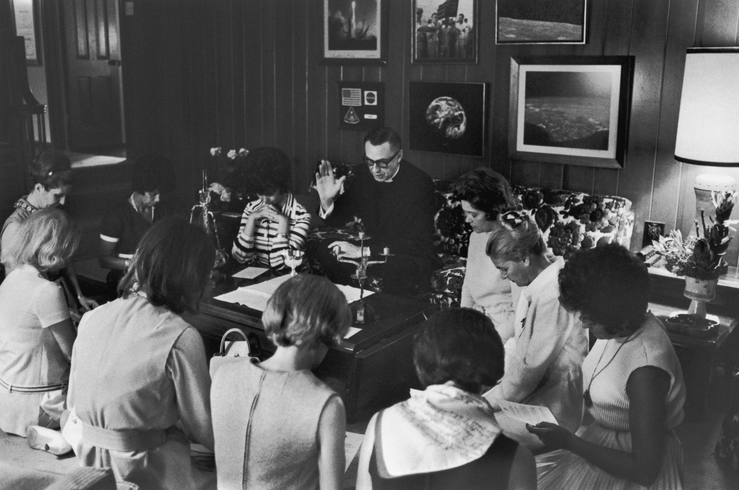 Father Donald Raish (center) holds a private service at the Lovell home during the Apollo 13 crisis, April 1970.