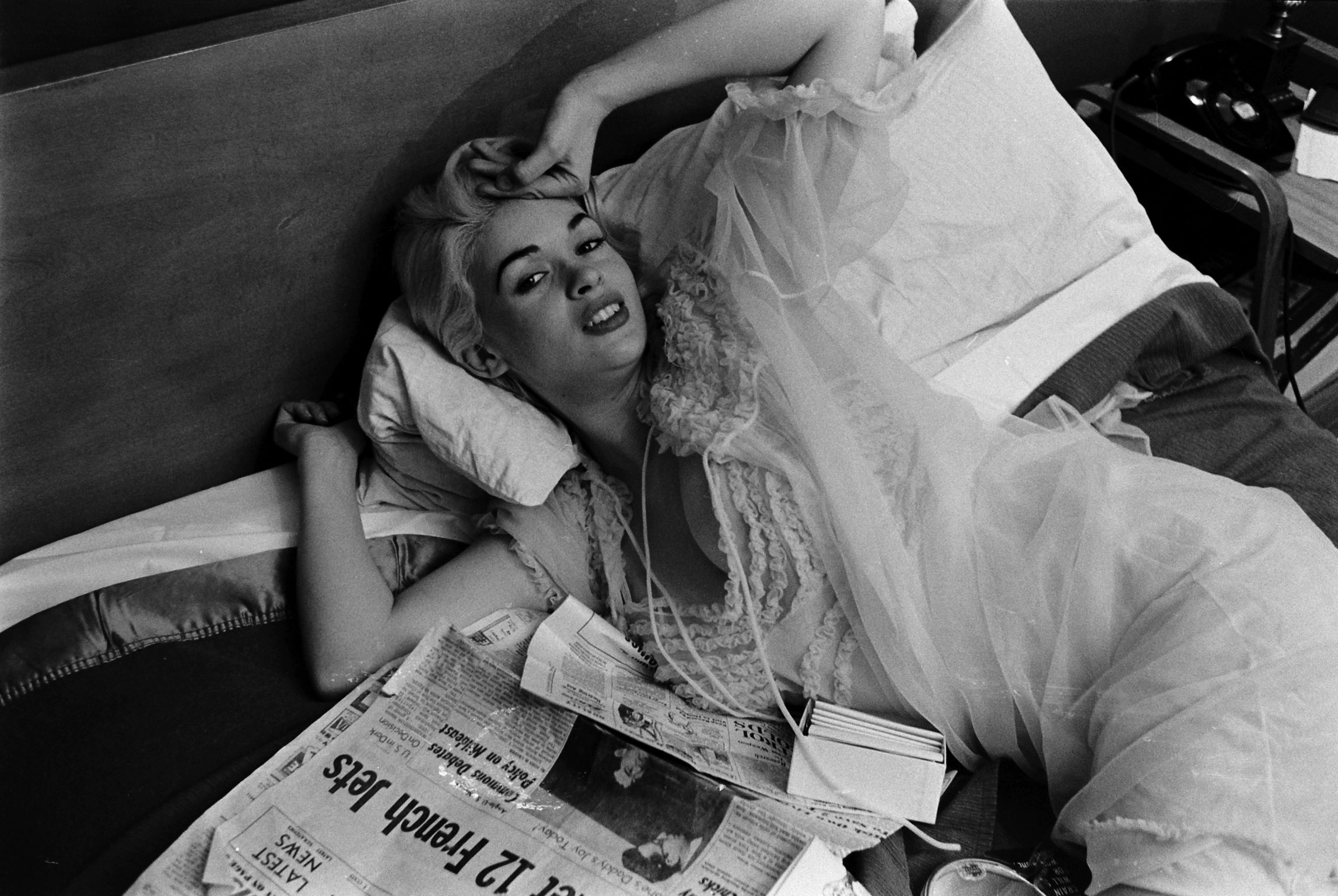 Jayne Mansfield sprawls in bed, Hollywood, 1956.