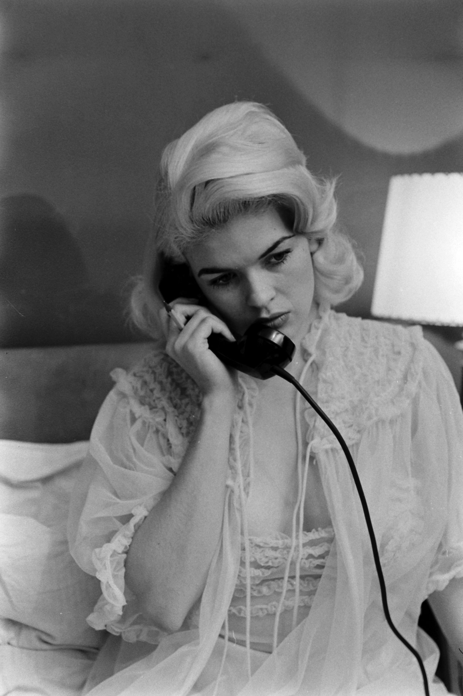 Jayne Mansfield poses on the phone at home in Hollywood, 1956.