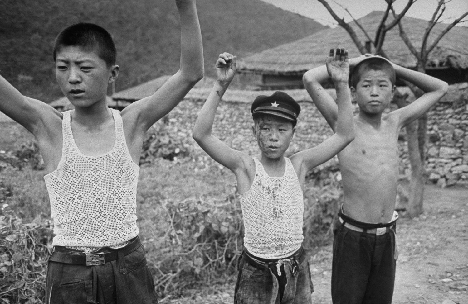 South Korean soldiers detain a group of suspected young communist rebels during an uprising against the Rhee government, 1948.