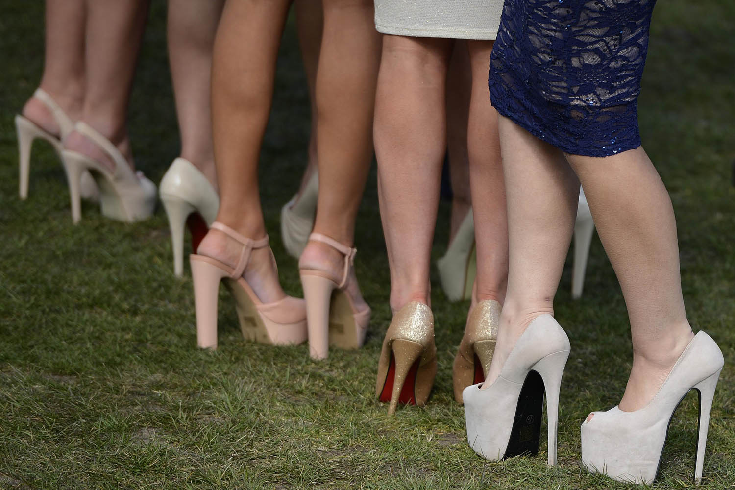 Racegoers shoes are seen as they arrive for the second day of the Grand National meeting at Aintree