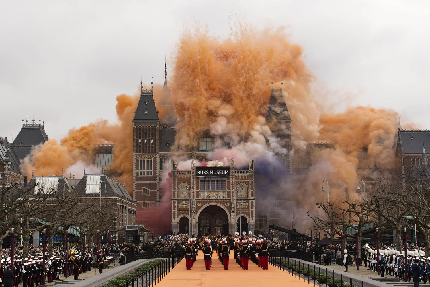April 13, 2013. Queen Beatrix of the Netherlands (not visible) ignites fireworks at the Rijksmuseum in Amsterdam. Thousands of people gathered outside Amsterdam's Rijksmuseum, home to Rembrandt van Rijn's  The Night Watch  and other Dutch masterpieces, as Queen Beatrix declared the national museum open on Saturday after a decade-long renovation.