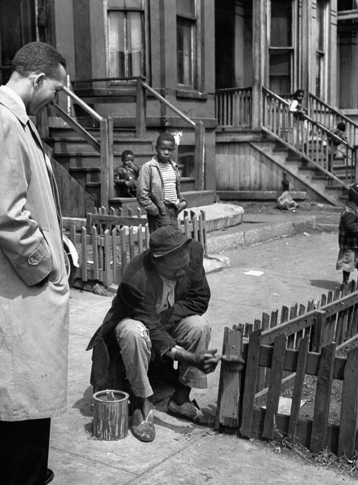 Neighborhood clean-up campaign organized by Rev. Ray Day (left), Chicago, 1954.