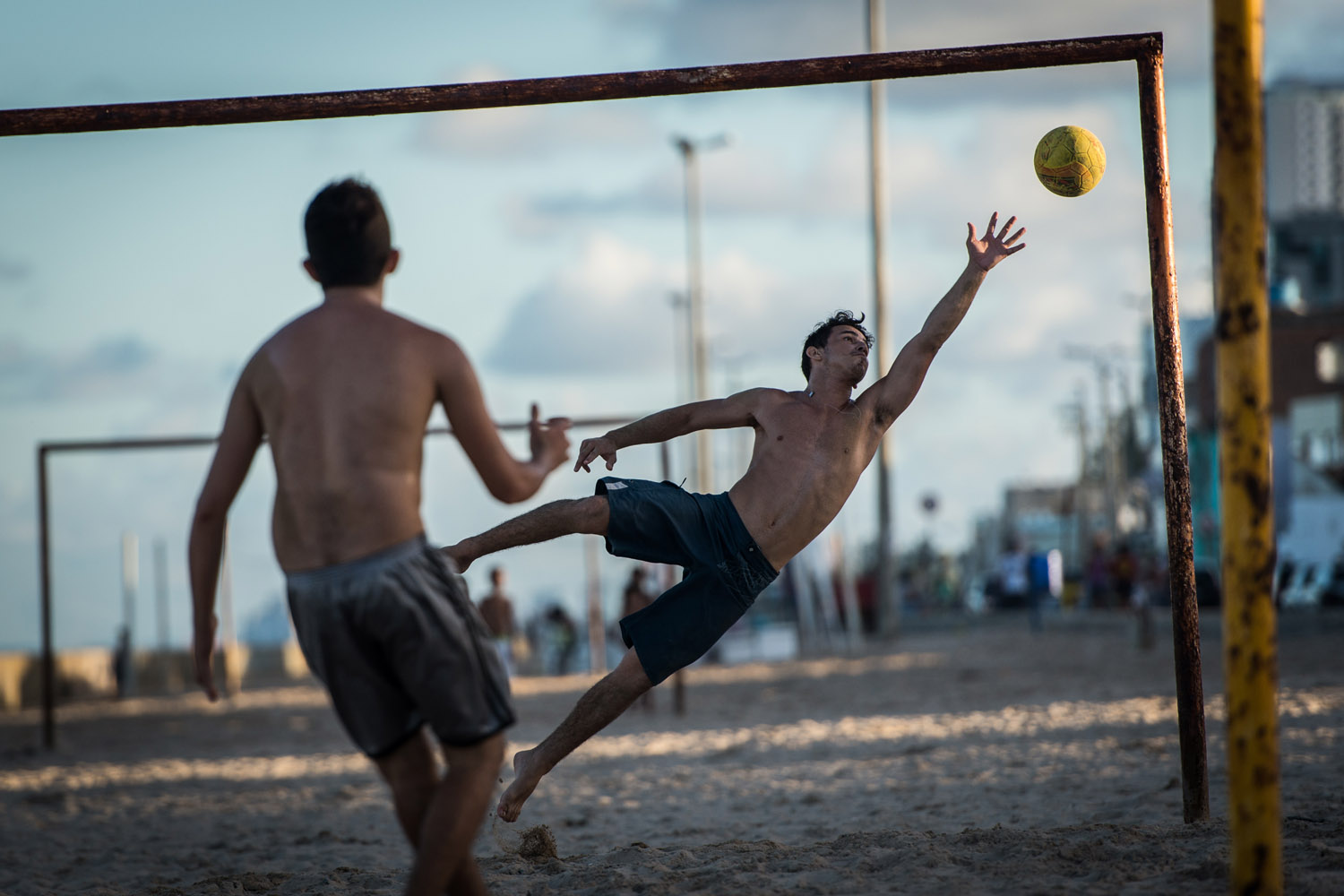 April 14, 2013. Kids play football on the beach in Recife, Pernambuco state, Brazil.