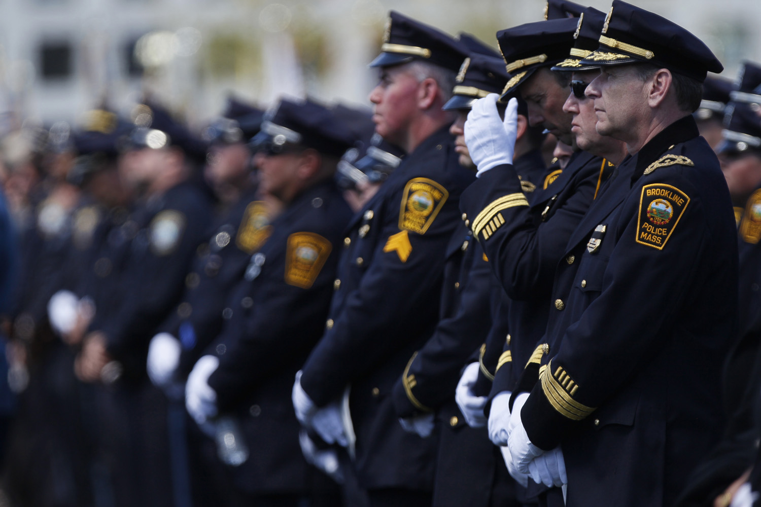 Law enforcement officers during a memorial service for police officer Sean Collier.