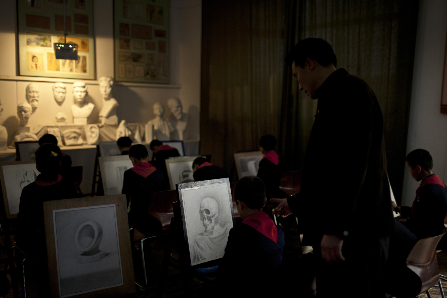 April 18, 2013. A teacher instructs during a drawing class at Mangyongdae Children's Palace in Pyongyang, North Korea.