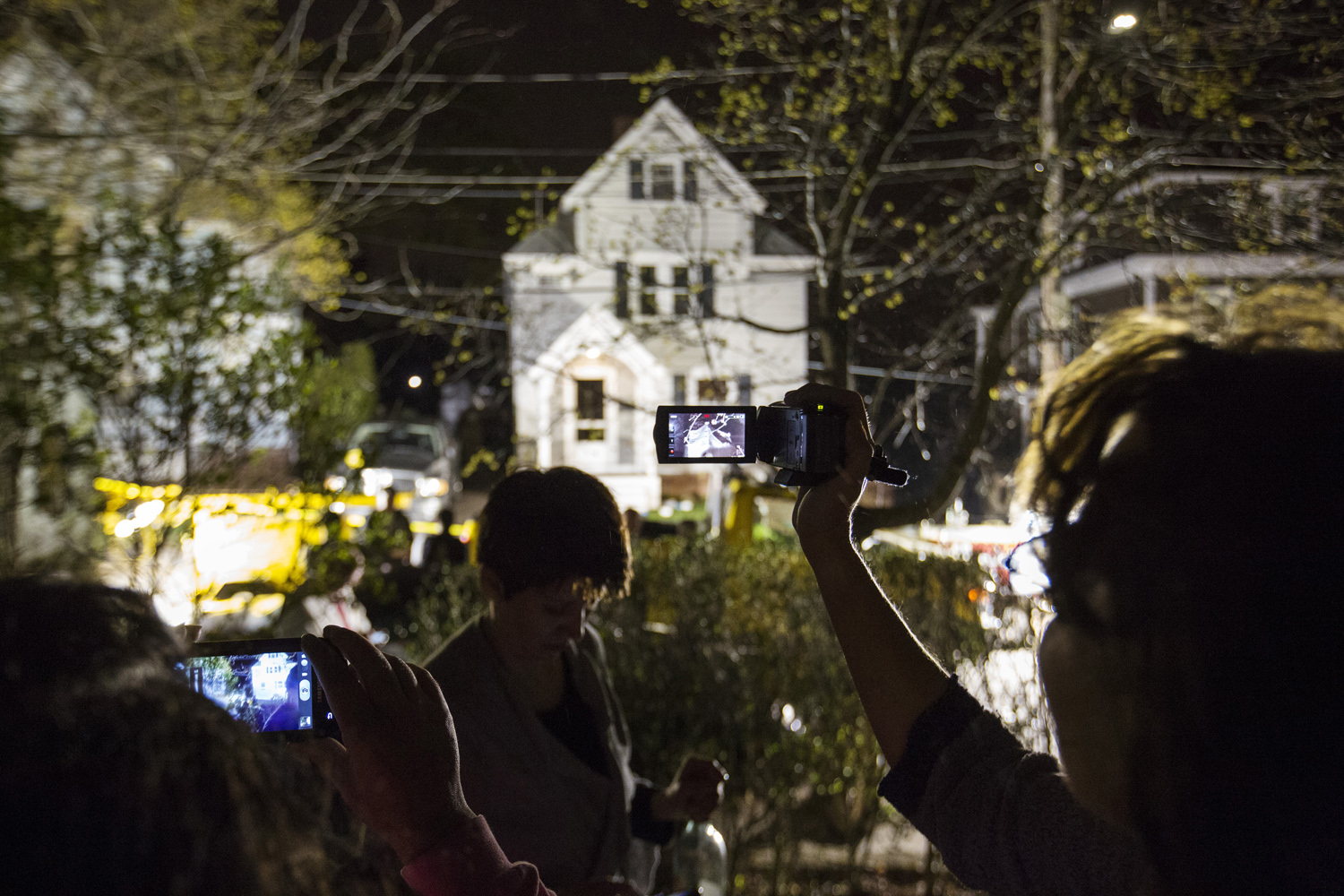 April 19, 2013. Neighbors use cameras to record images of the boat at 67 Franklin St. where Dzhokhar Tsarnaev, the surviving suspect in the Boston Marathon bombings, was hiding,  before being taken into custody by police, in Watertown, Massachusetts