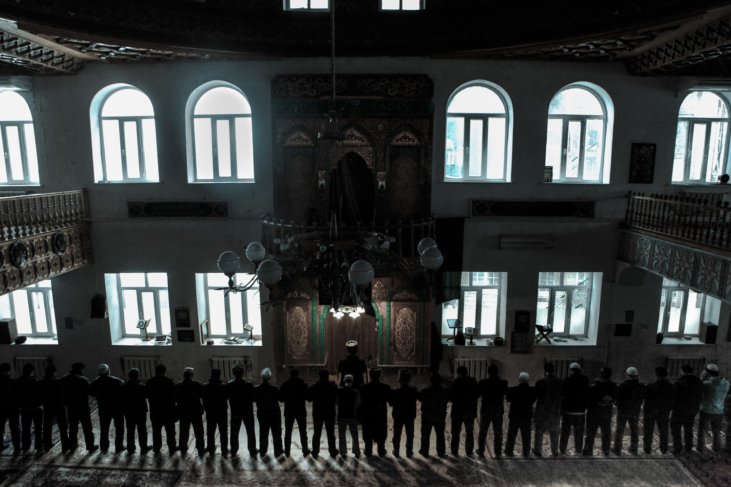 Men praying in mosque.