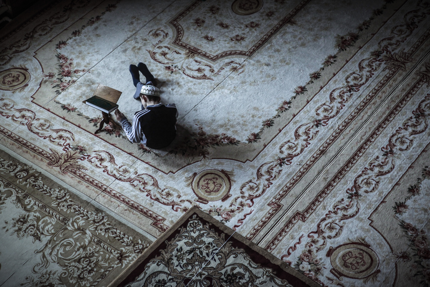 A boy studying Koran in a mosque in Makhachkala.