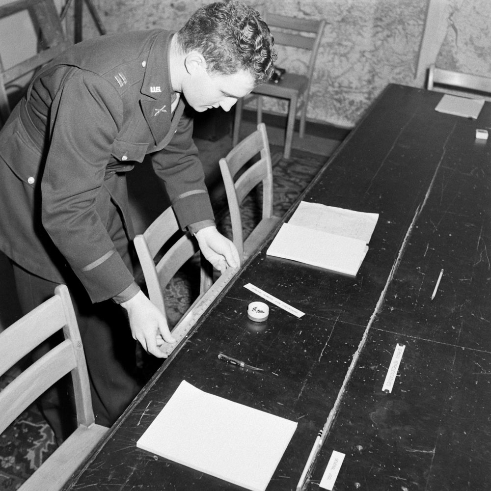 Arranging the table in the "little red schoolhouse" in Reims, France, where Germany signed the Instrument of Surrender that ended the Second World War in Europe, May 7, 1945.
