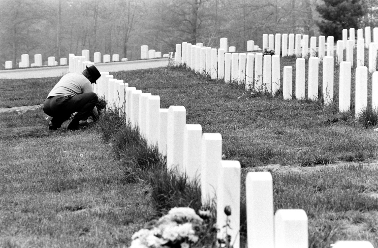 Tending a grave, Arlington National Cemetery, 1965.