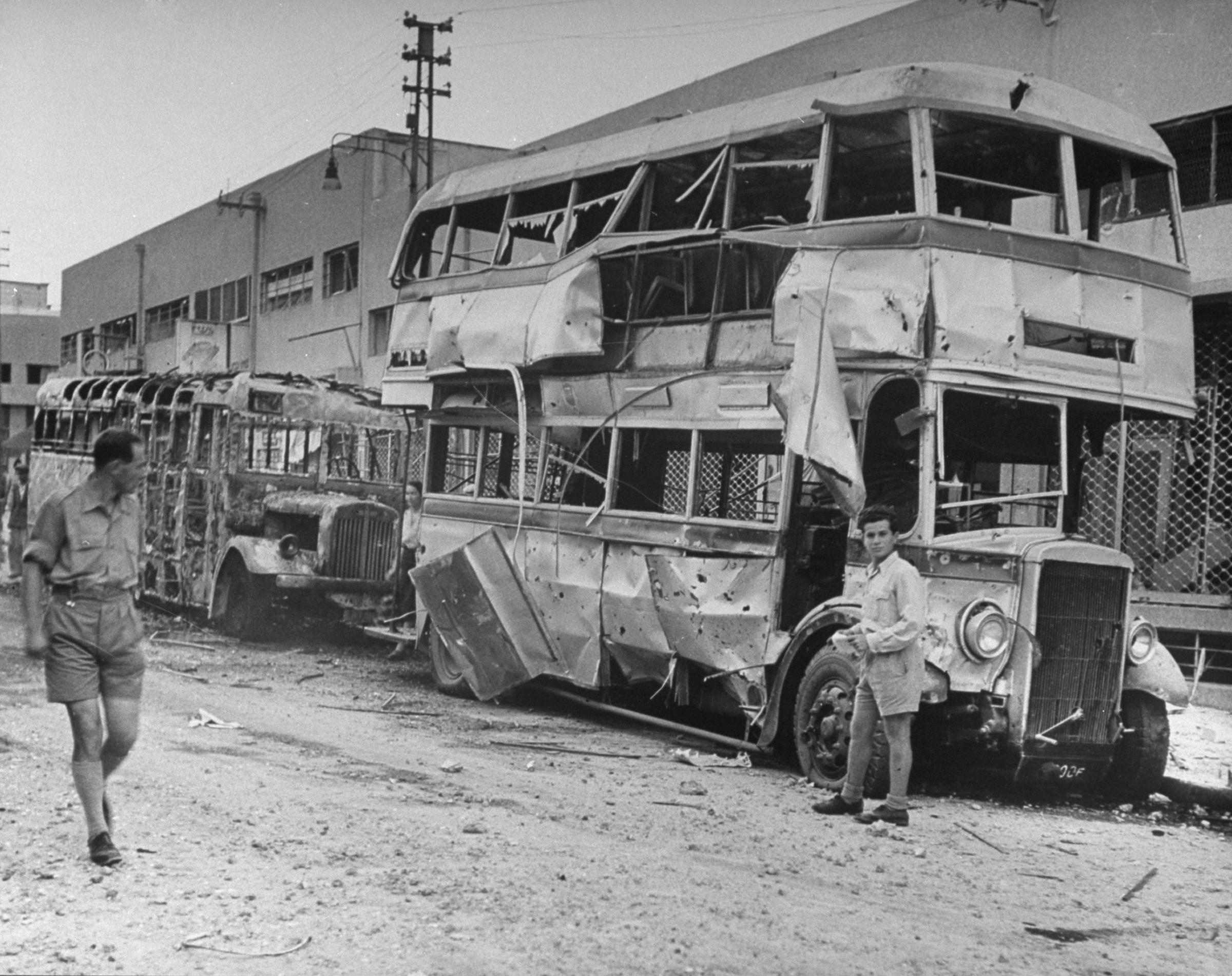 Burned-out buses seen shortly after the establishment of the state of Israel, exact location unknown, May 1948.