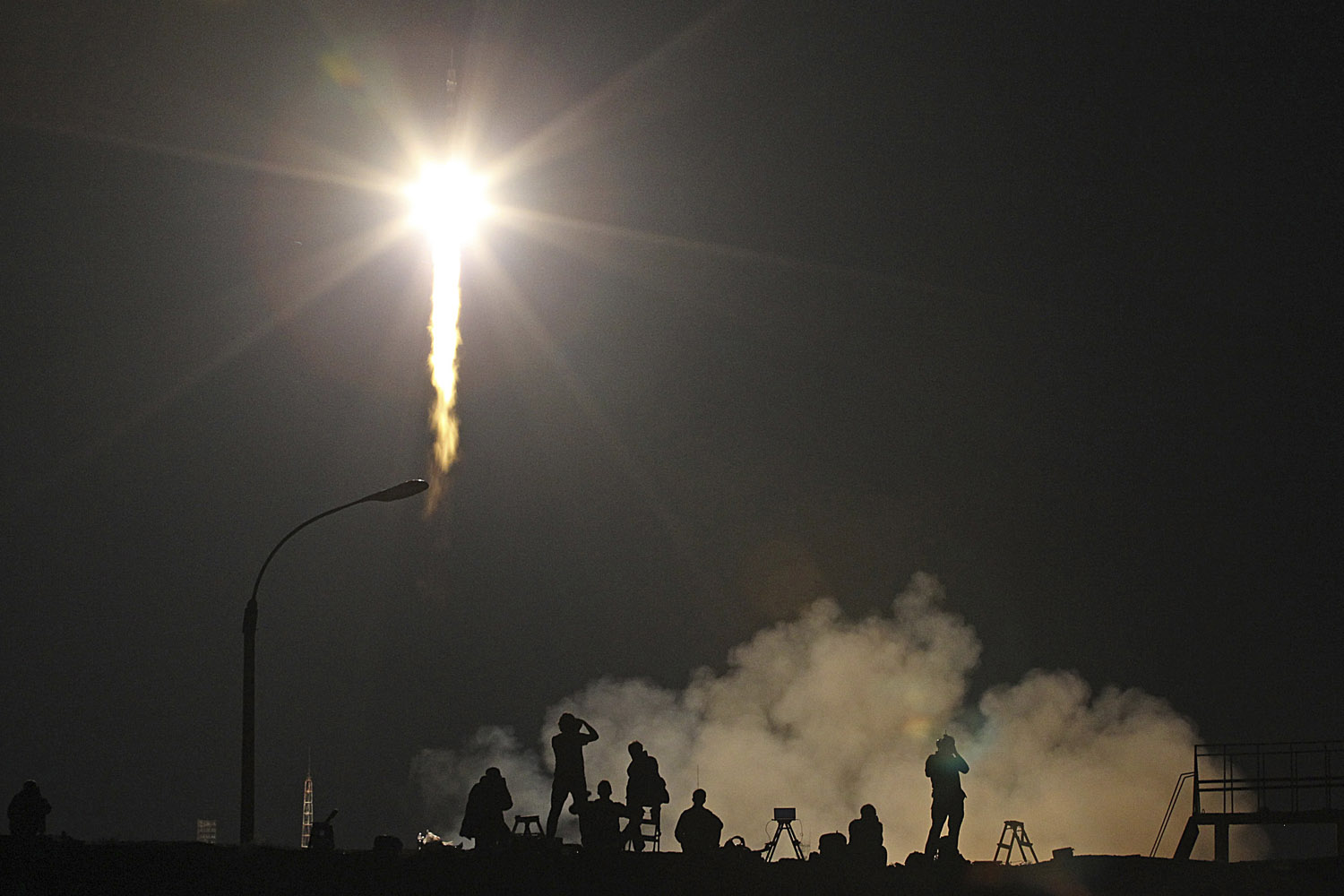 May 29, 2013. Photographers take pictures of the launch of Soyuz-FG rocket booster with Soyuz TMA-09M space ship carrying a new crew to the International Space Station, ISS, as it blasted off at the Russian-leased Baikonur Cosmodrome, Kazakhstan.