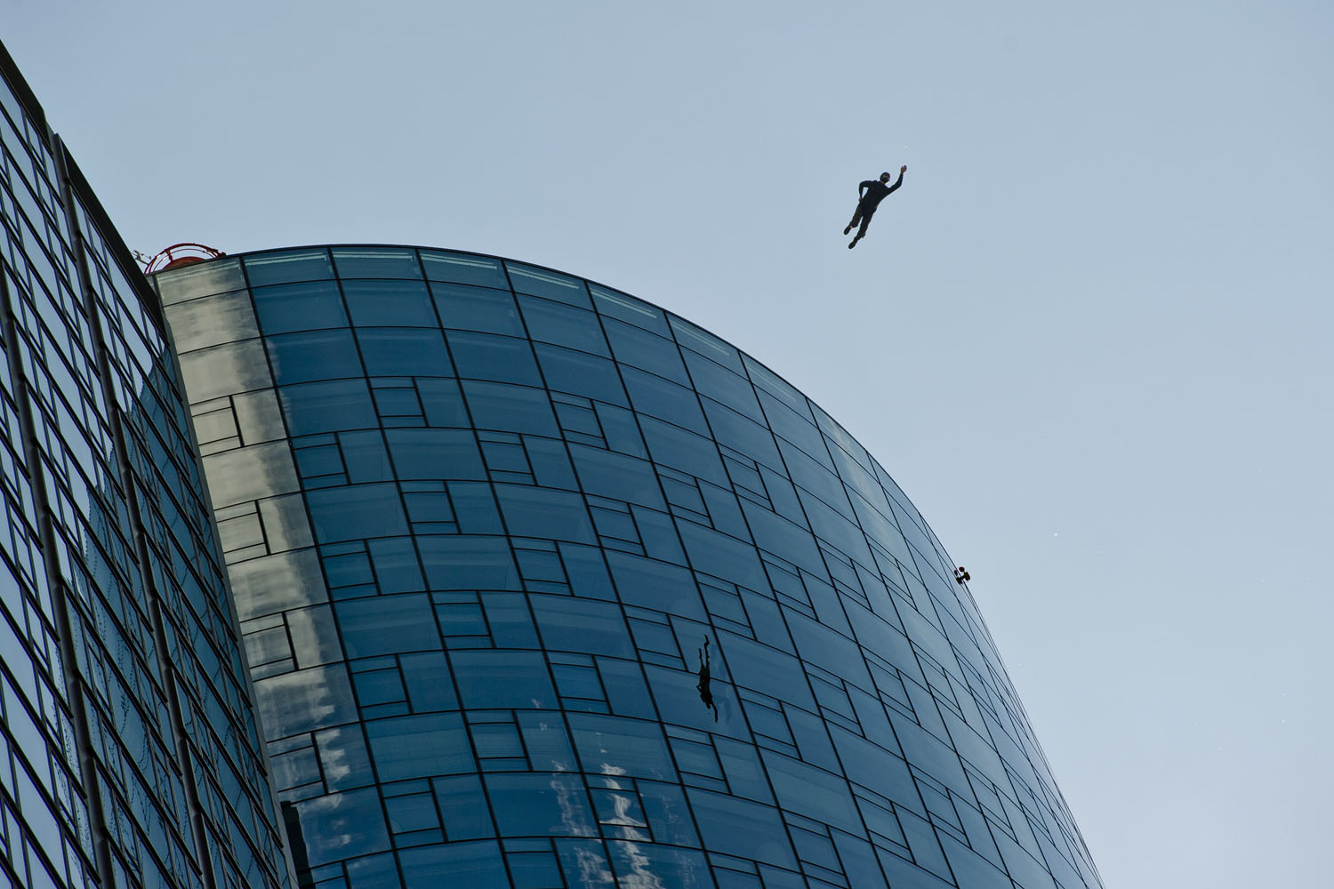 May 25, 2013. A base-jumper jumps off the Maintower as part of the sky scraper festival in Frankfurt am Main, Germany.