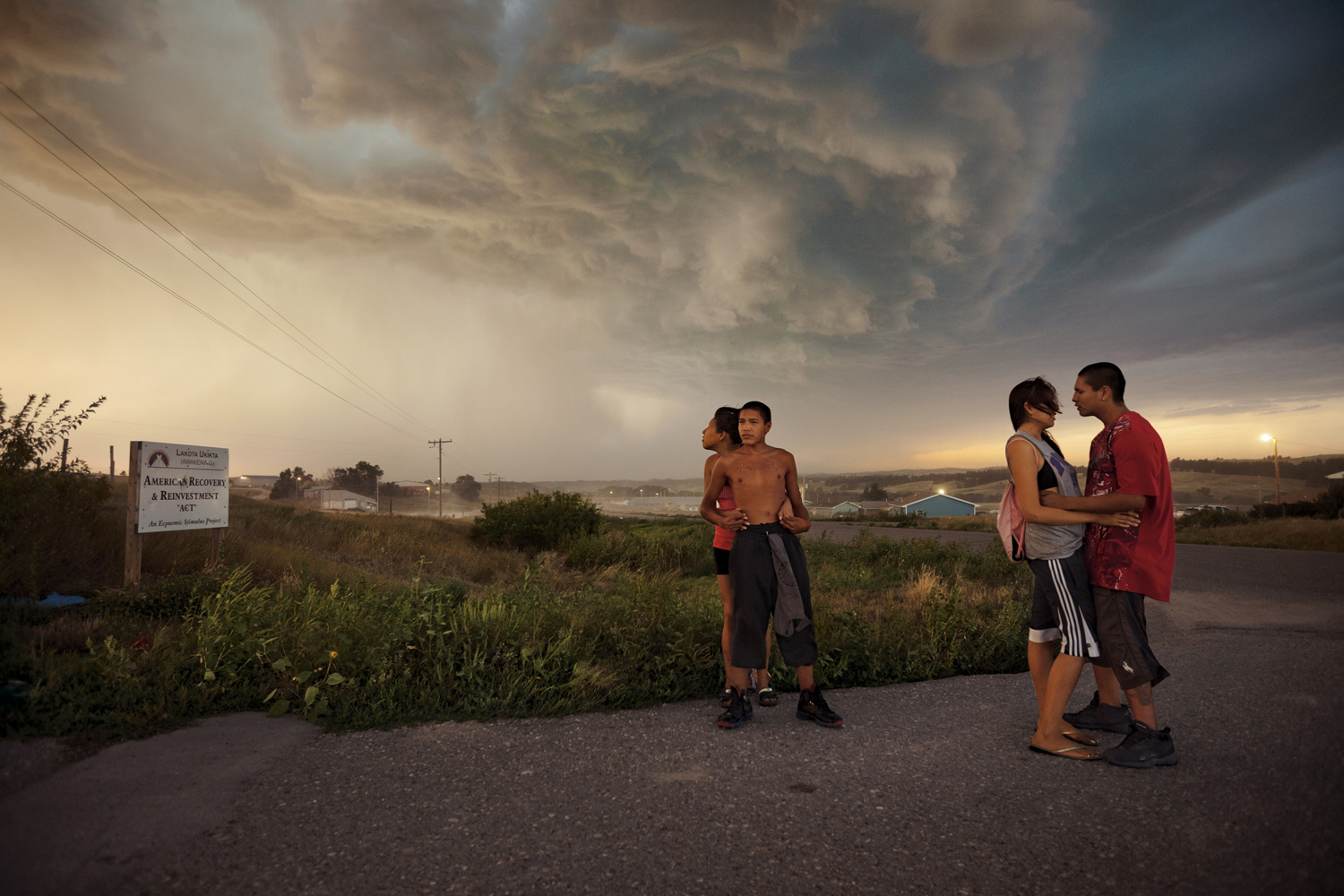 Teenagers disregard the threat of a summer storm in the town of Wounded Knee.