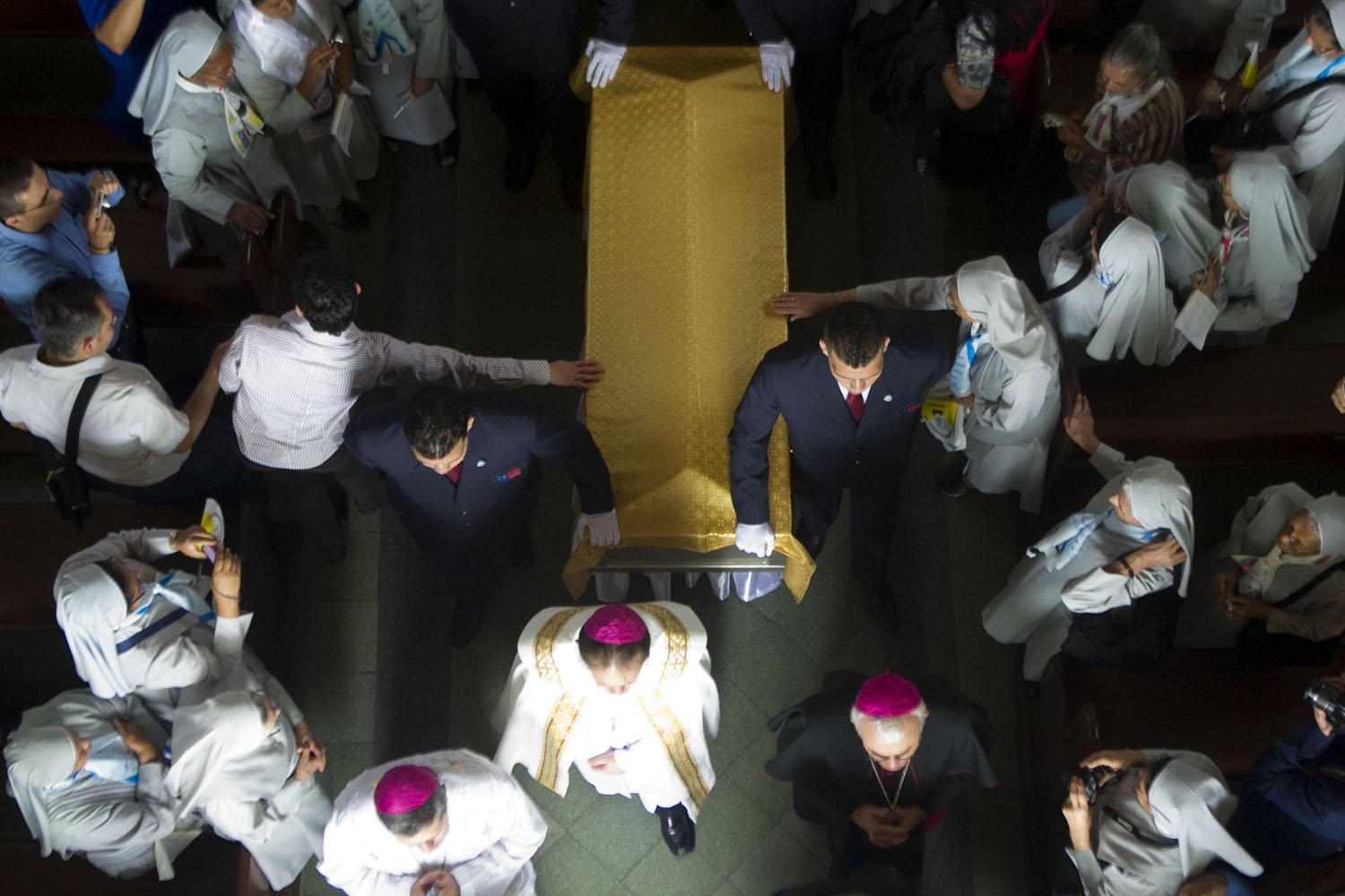 May 26, 2013. Members of a funeral home carry the coffin with the remains of Saint Mother Laura Montoya to her tomb during a ceremony  for the 139th anniversary of her birth  at the convent where she lived in Medellin, Antioquia department, Colombia.