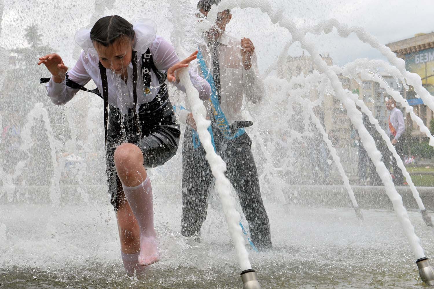 May 24, 2013. Ukrainian students play in a fountain during a gathering of school graduates at Independence Square in Kiev as they mark  Last Bell  celebrating the day they leave school.