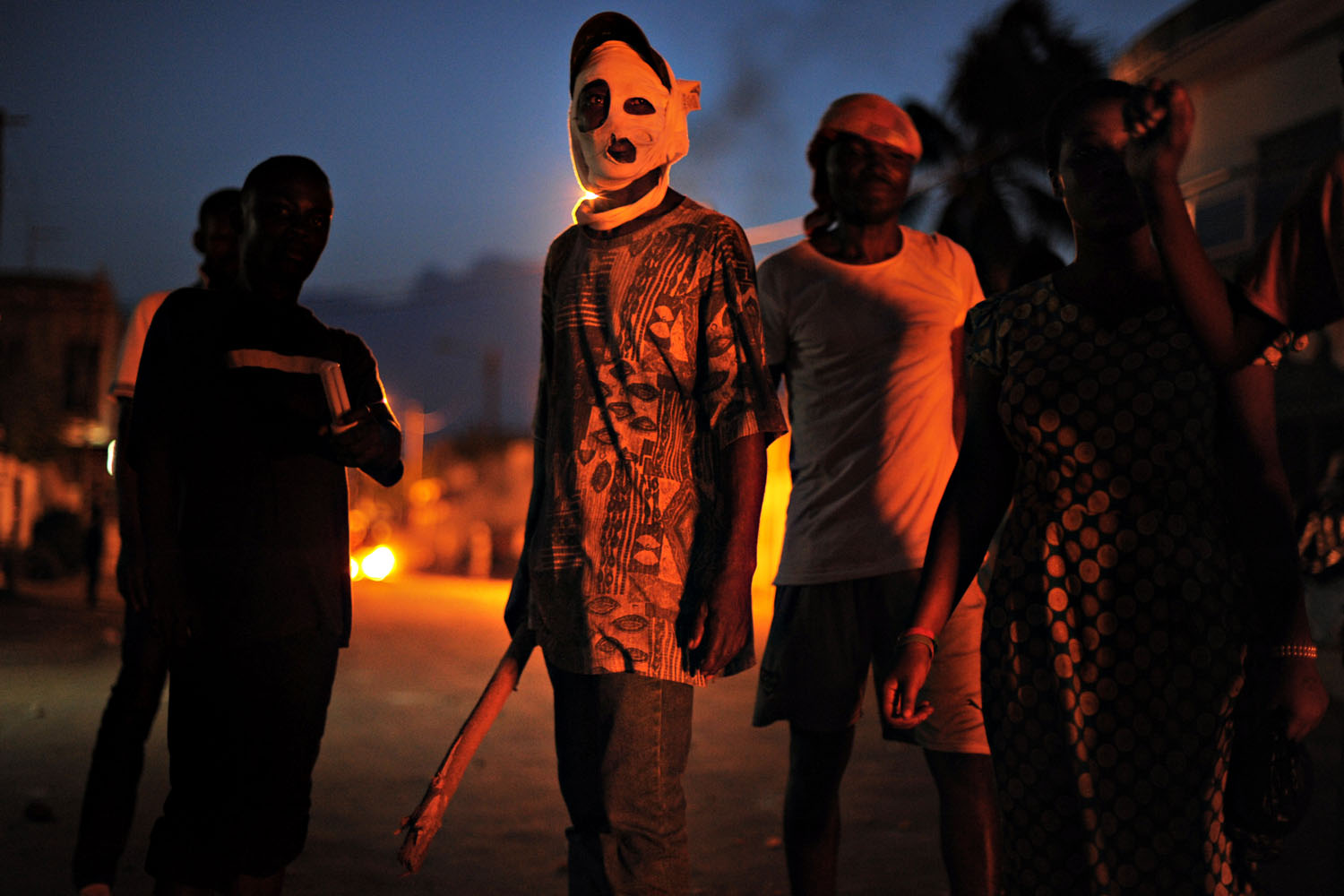 May 25, 2013. An opposition supporter masks his face to hide his identity late as protesters clashed with police in the Kodjoviakope neighborhood of Lome, Togo. Authorities have banned all protests in the capital after violent clashes this week.