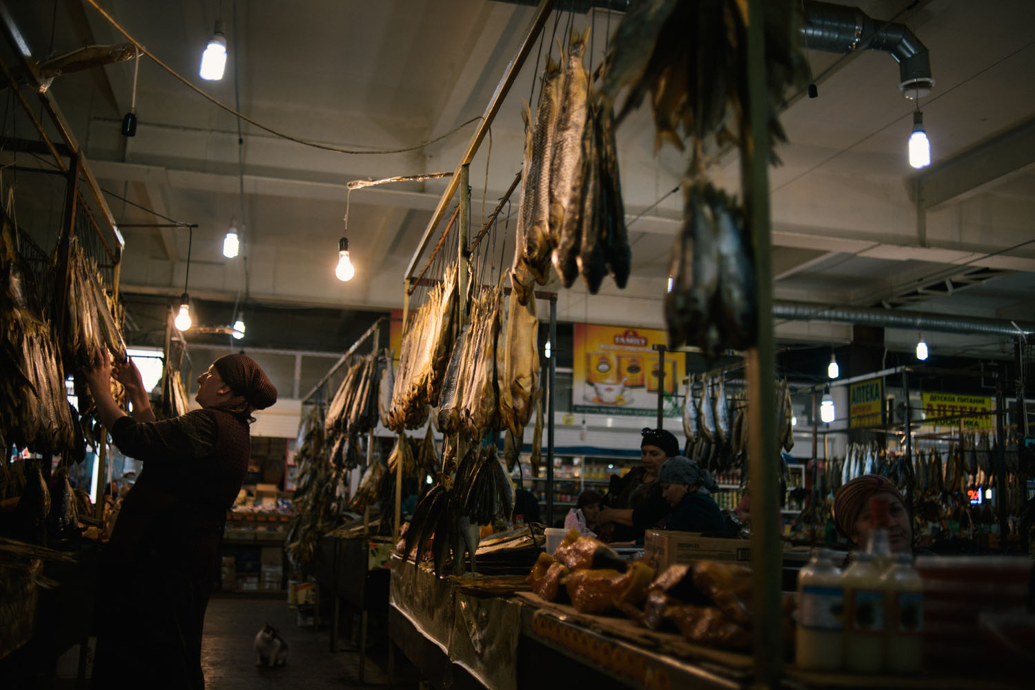 A woman watch the fish at the market in Makhachkala on May 14, 2013.