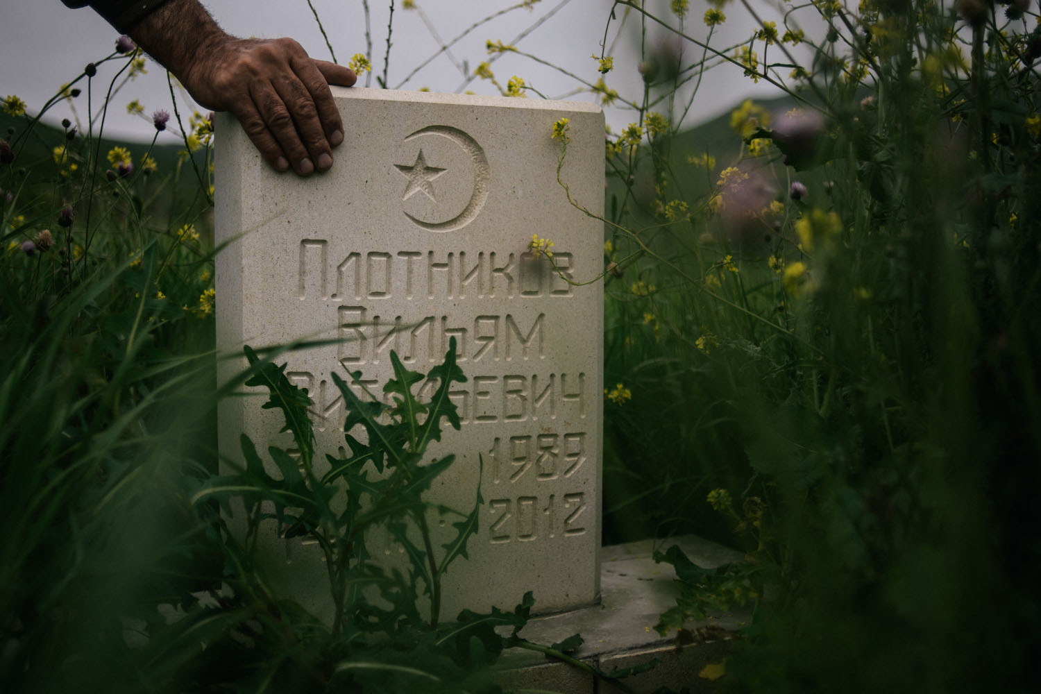 The grave of William Plotnikov is seen on May 12, 2013 in village UTAMYSH, where William Plotnikov lived and died