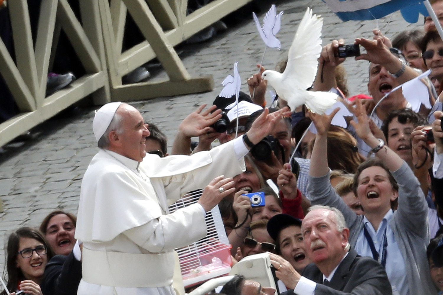 Pope Francis holds a dove before his Wednesday general audience at San Peter's square at the Vatican
