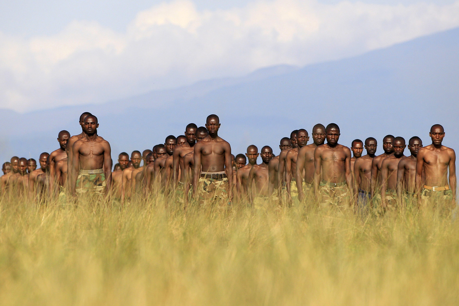 M23 rebel recruits stand at attention during a training session in eastern Democratic Republic of Congo