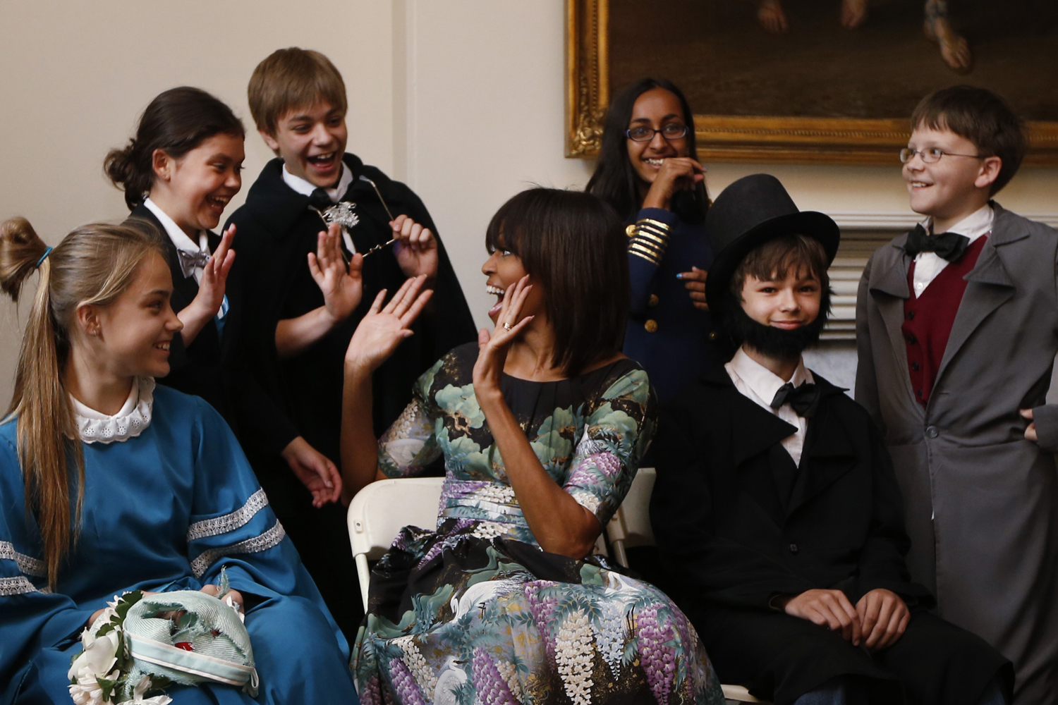 U.S. first lady Obama reacts with school children from Willow Springs Elementary School in Fairfax, Virginia