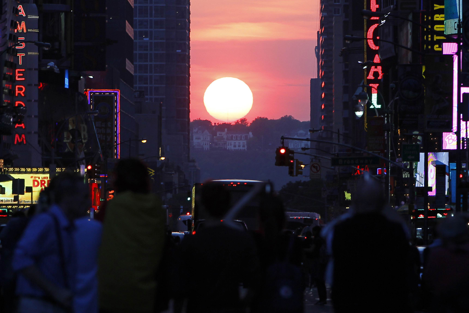 May 29, 2013. The sun shines down 42nd Street at sunset during the biannual occurrence named  Manhattanhenge  in New York, when the setting sun aligns itself with the city's street grid.