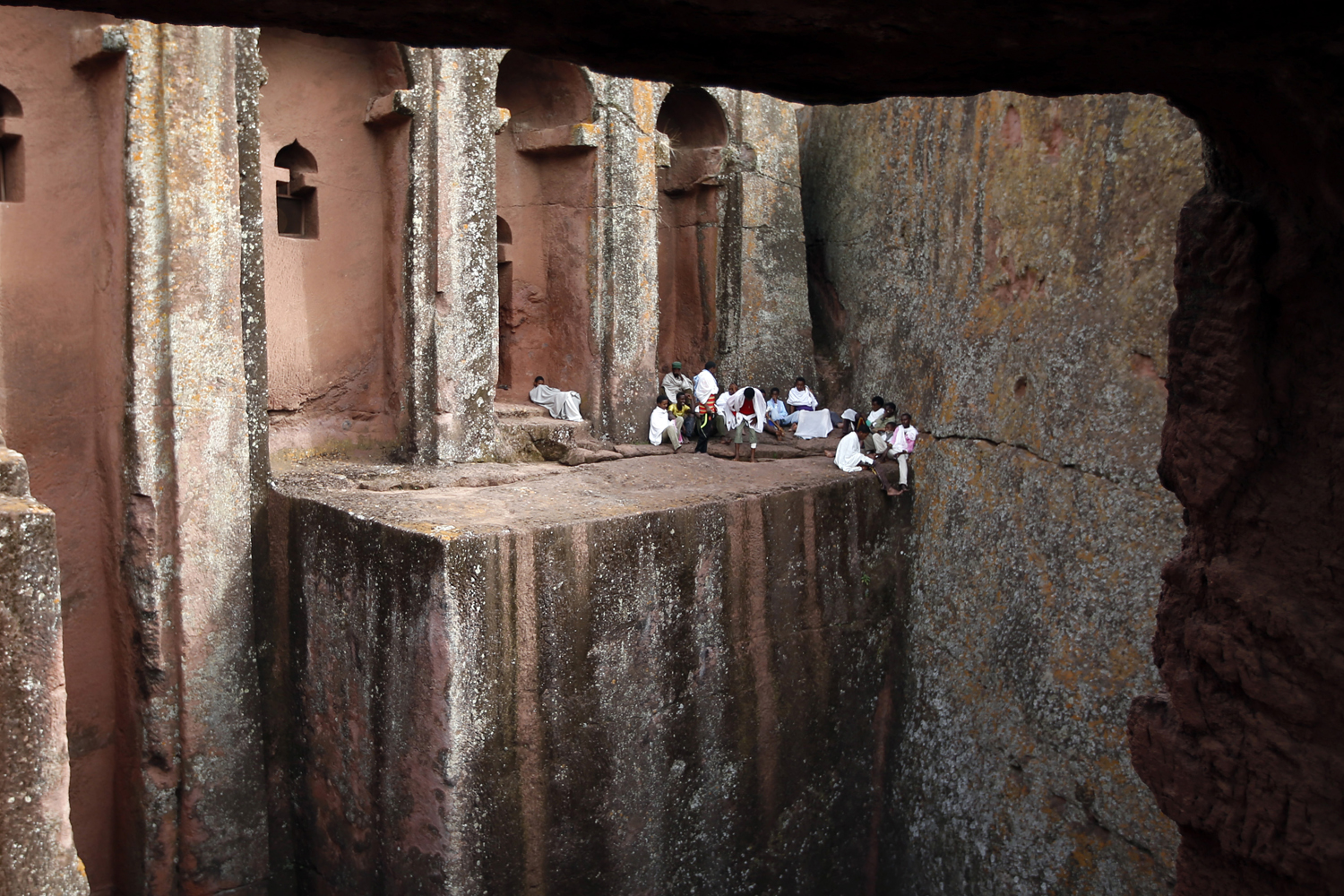 Orthodox Christians sit outside the famous monolithic rock-cut churches during a Good Friday celebration in Lalibela