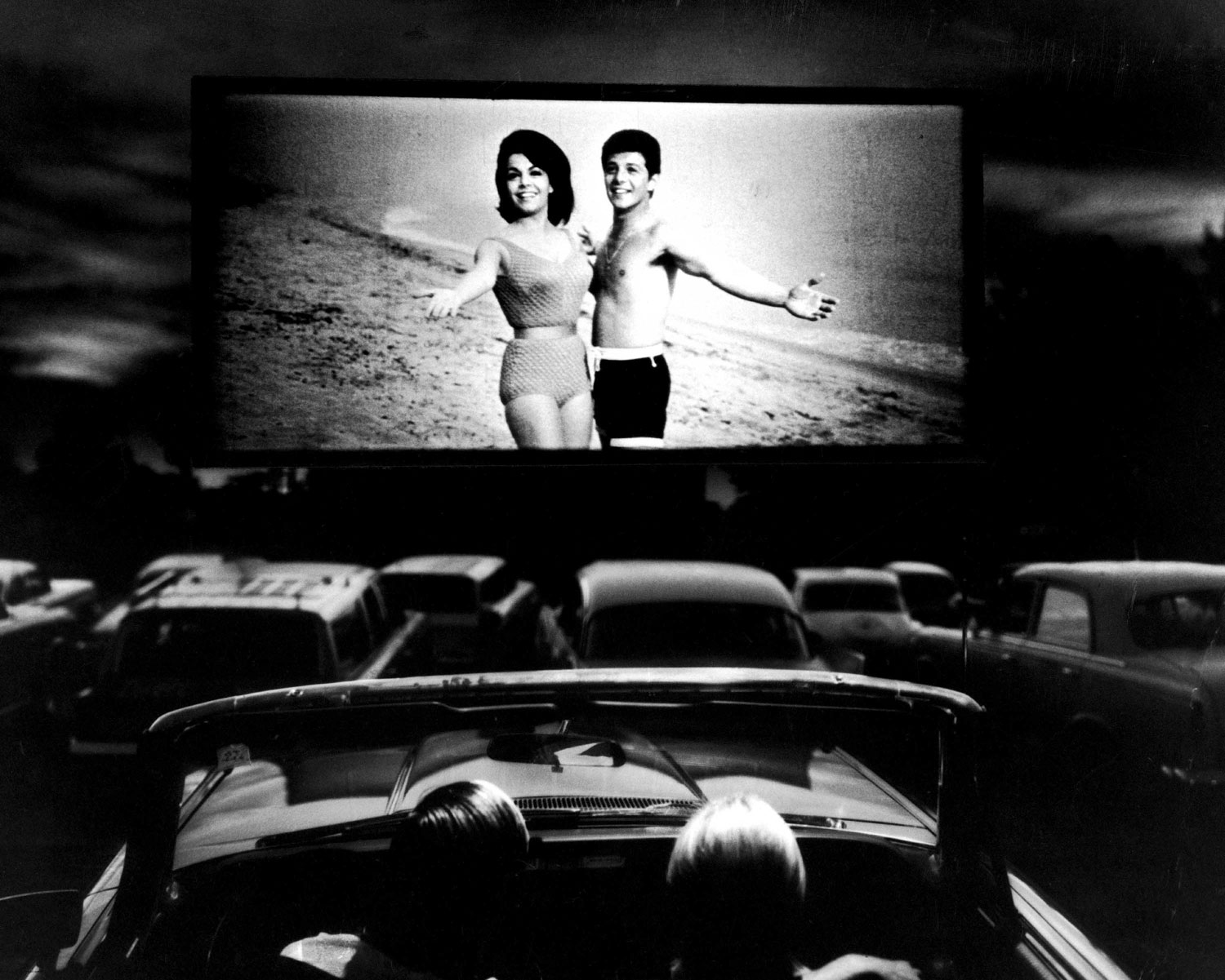 Annette Funicello and Frankie Avalon in a scene from Beach Blanket Bingo, shown at a drive-in movie theater in Florida, 1965.