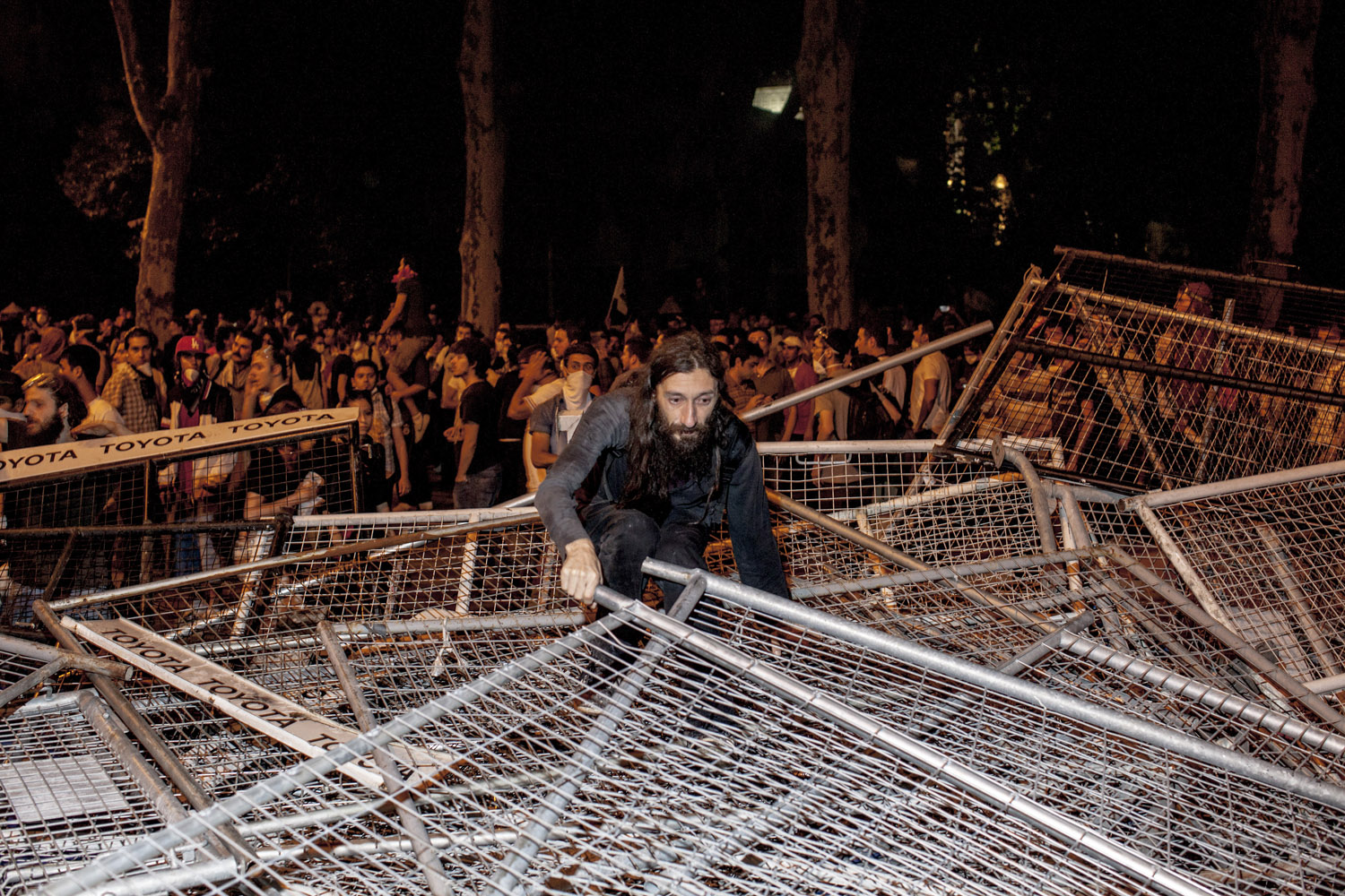 An anti-government protester attempts to build a barricade to stop the riot police from advancing in the Besiktas area of Istanbul. At this stage, the protesters were a mix of anarchists, football fans and bystanders.